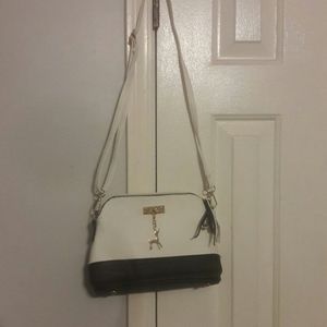 Black and white small crossbody bag. Unused.